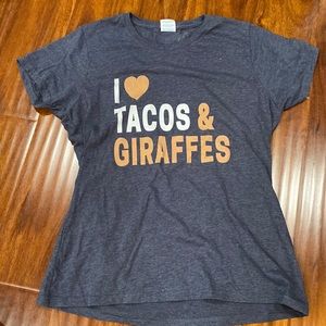 Dark blue T-shirt that says I Live Tacos and Giraffes